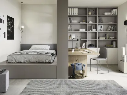 Cameretta con letto su cassettone e ampia libreria Next space 02 di Nidi